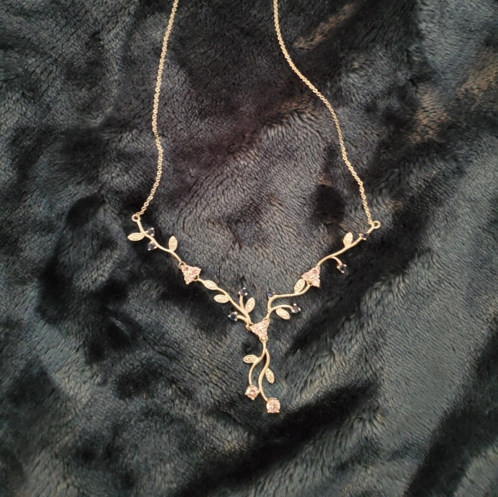 silver necklace with pink and blue gems